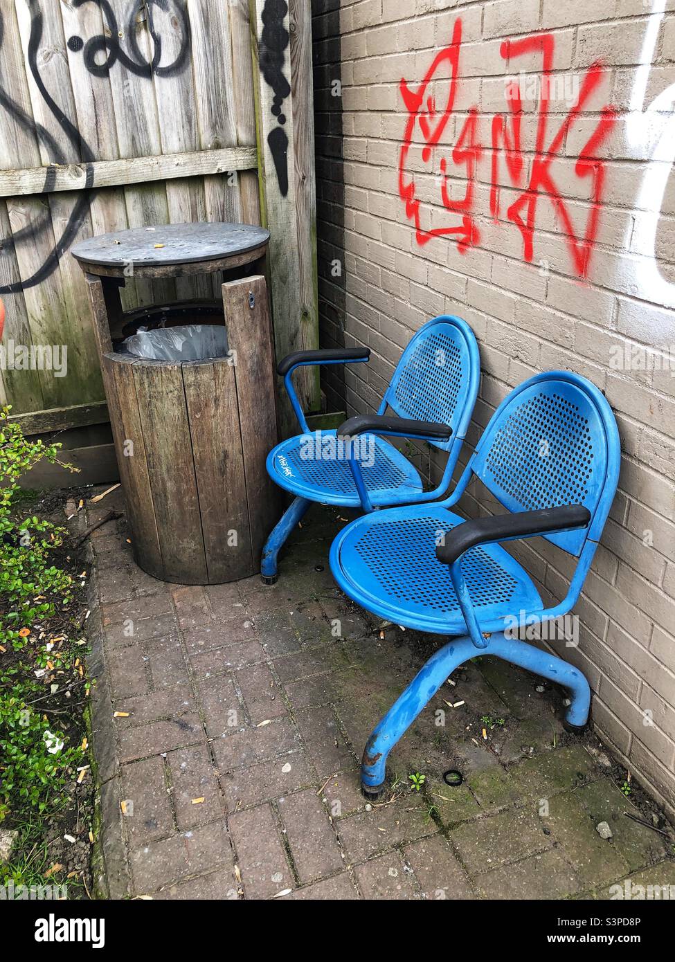 Two blue chairs abandoned with the rubbish - Smartphone Captured Stock Image