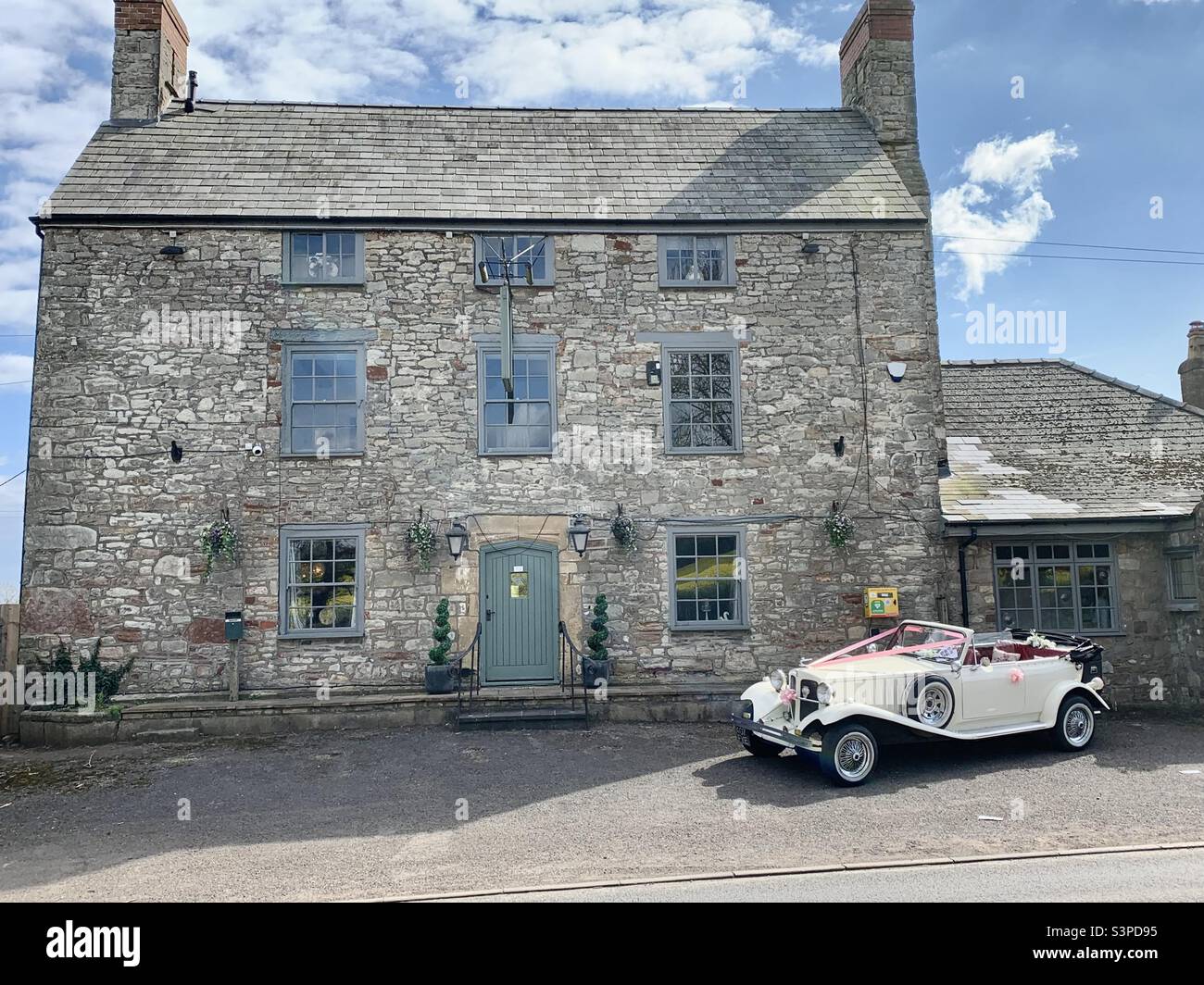 A vintage bridal car (Beauford) parked outside the Moulton Brooke Lodge, Pwllmeyric, Chepstow, South Wales - Smartphone Captured Stock Image