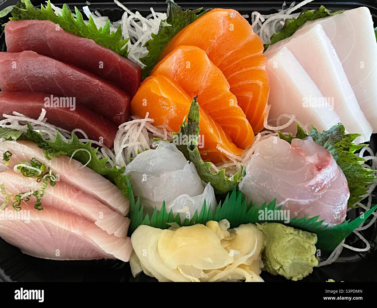 Flat lay of an assorted sashimi delivery meal, 2022, USA, New York City - Smartphone Captured Stock Image