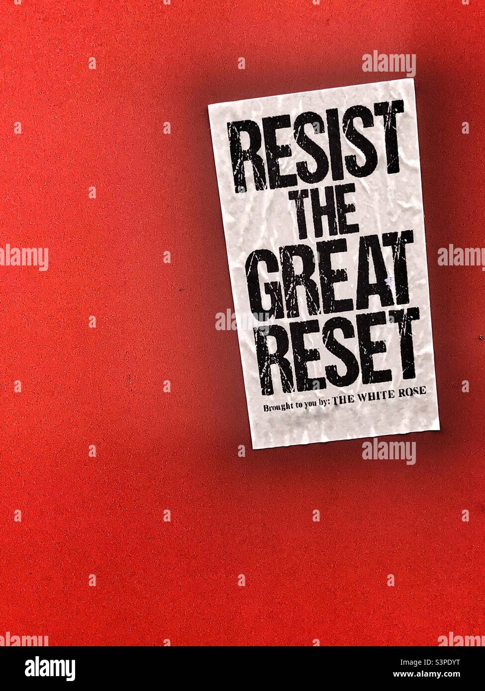 Resist the Great Reset flyer on wall - Smartphone Captured Stock Image