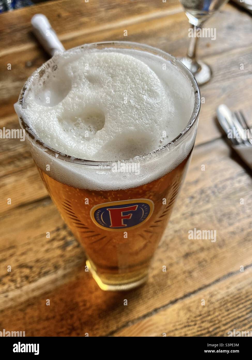 Pint of fosters lager - Smartphone Captured Stock Image