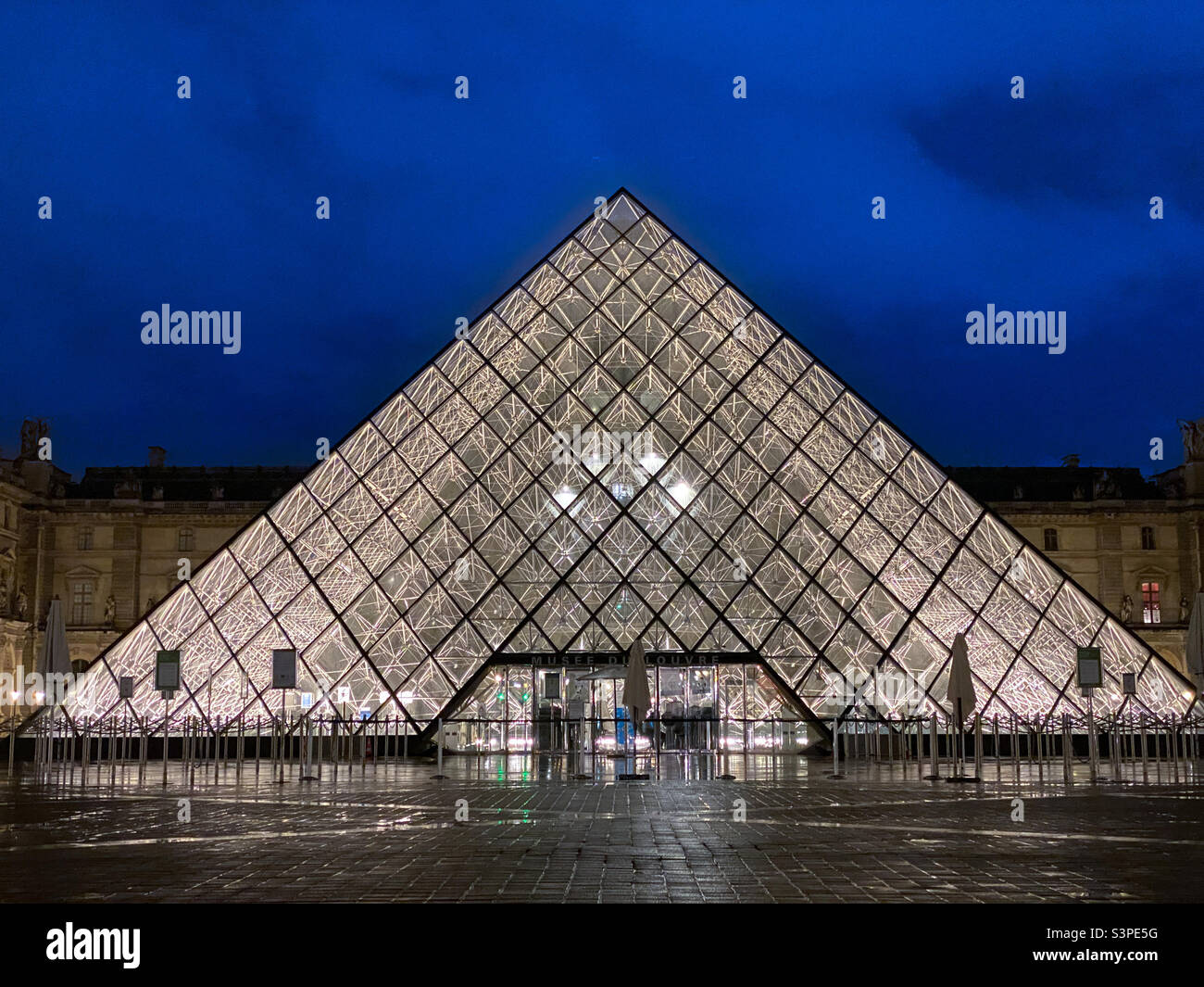 The iconic and controversial Pyramid in the courtyard of the Louvre in Paris, France Stock Photo