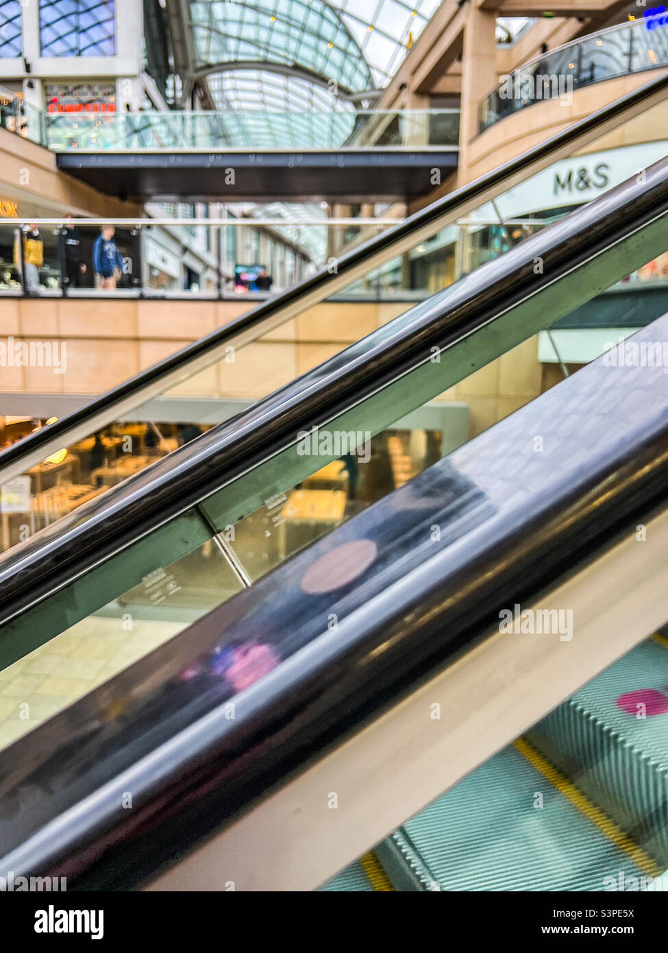 Escalators in retail shopping park Stock Photo