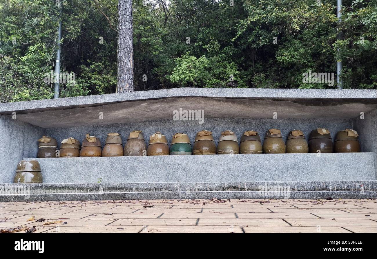 Chinese burial jars in a small cemetery on Lantau island,Hong Kong. Stock Photo