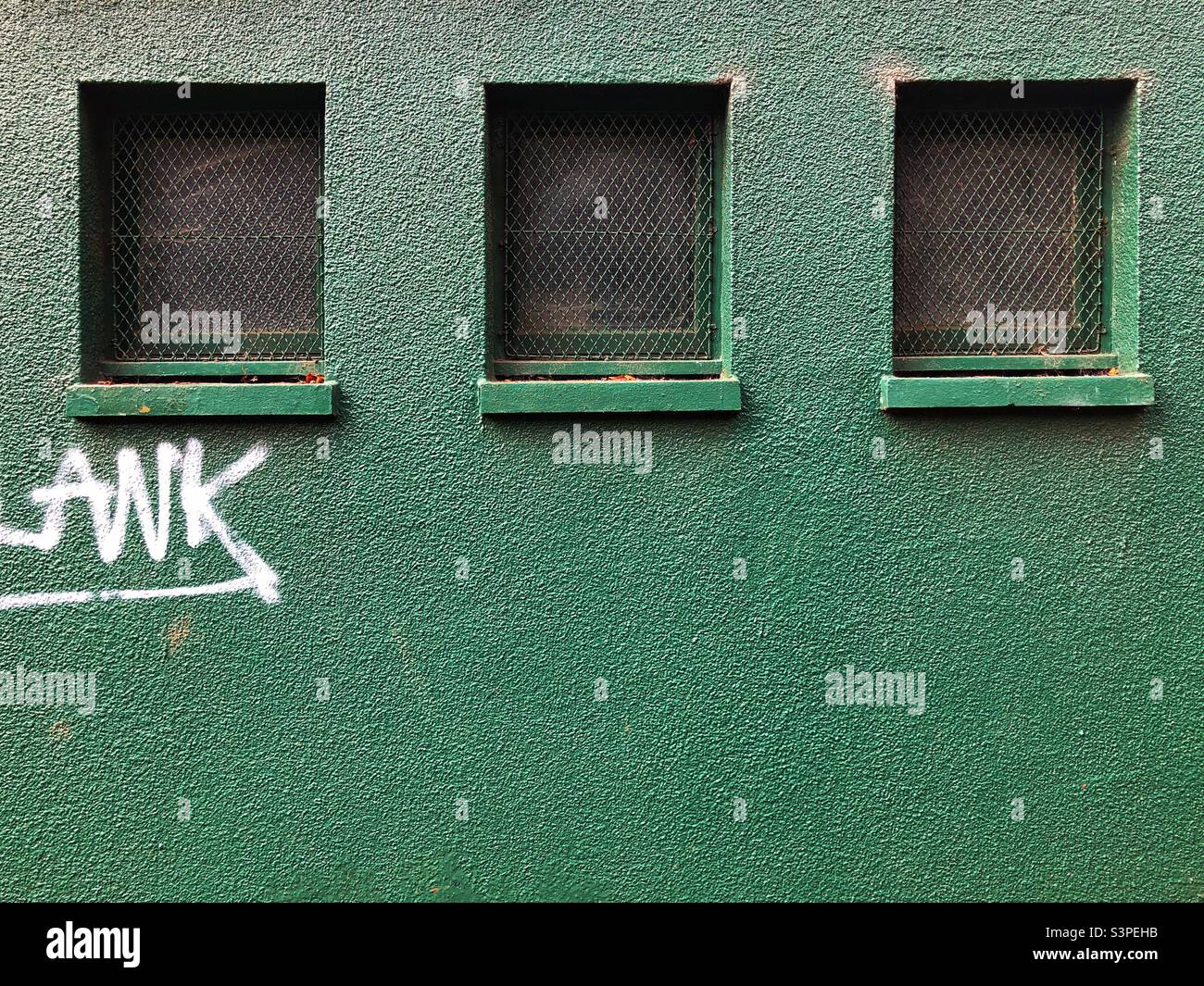Three windows with security grille Stock Photo