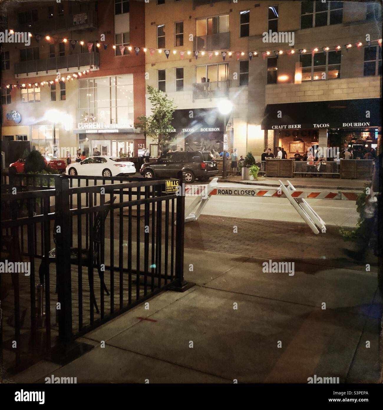 A view of a Cincinnati, Ohio street at night, using a Hipstamatic app, through a window. - Smartphone Captured Stock Image