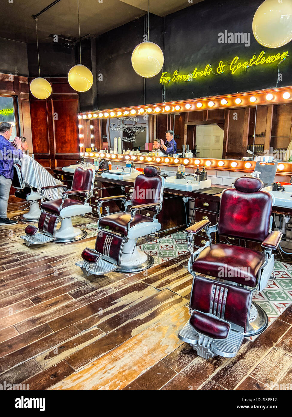 Inside trendy barbershop in Leeds West Yorkshire Stock Photo