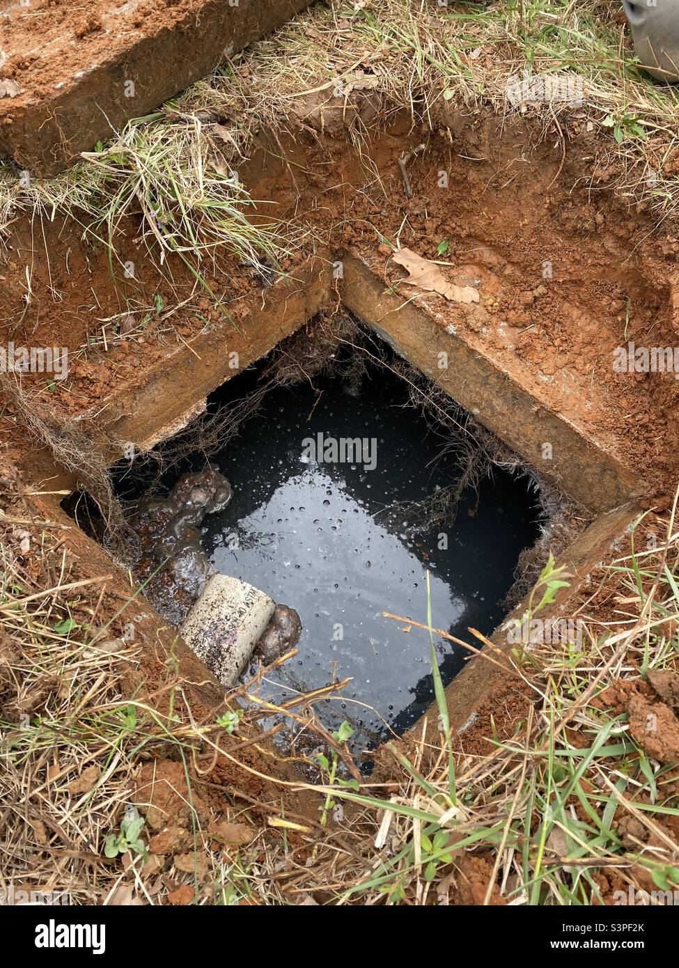 Overhead view of septic tank with lid off. Stock Photo