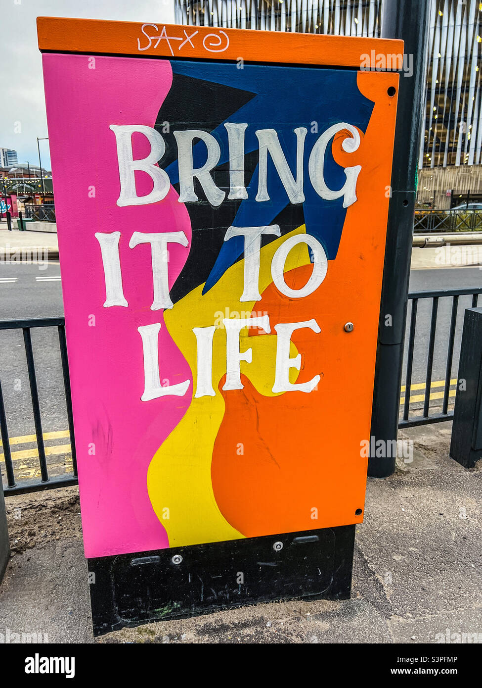 Bring it to life art graffiti on phone exchange box in Leeds Stock Photo