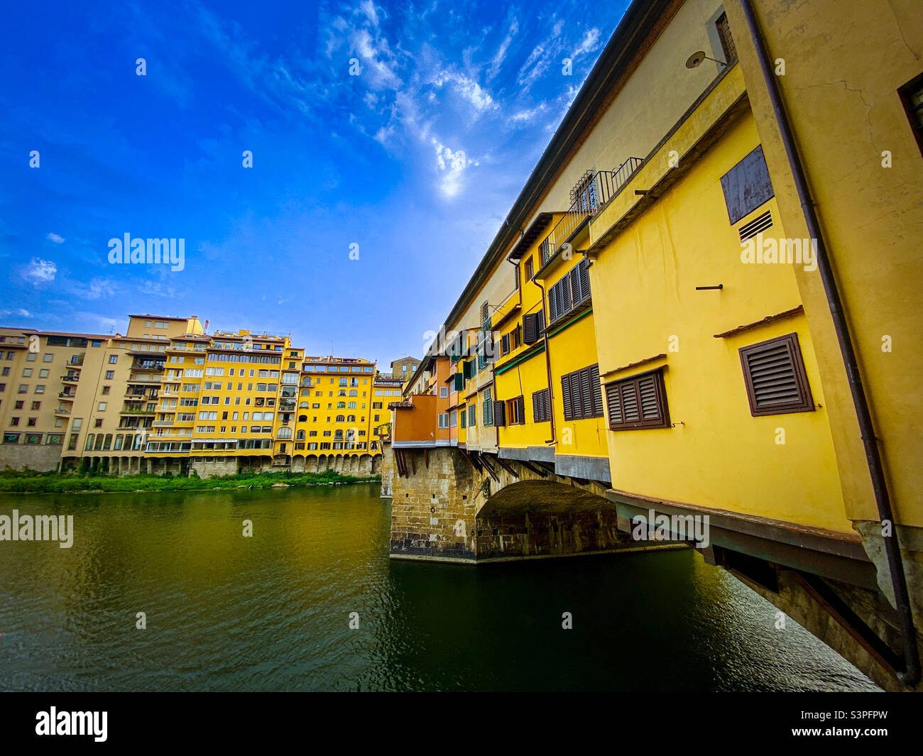 The historic Ponte Vecchio spanning the Arno River in Florence, Italy - Smartphone Captured Stock Image