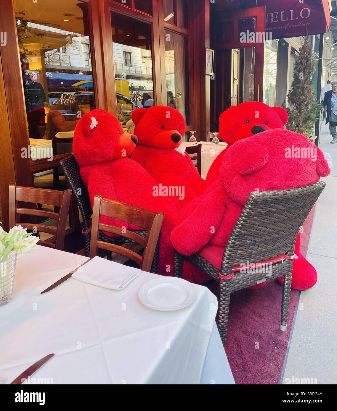 Giant stuffed bears dining outdoors in NYC - Smartphone Captured Stock Image