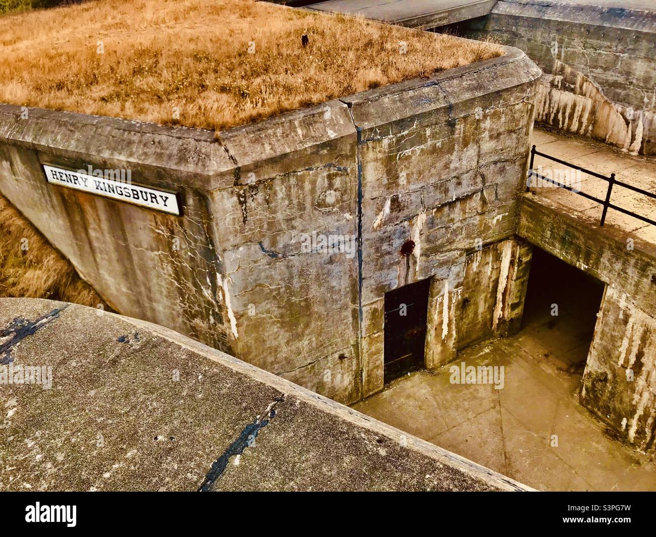 An abandoned and overgrow World War II era bunker at historic fort Casey near Seattle Washington Stock Photo
