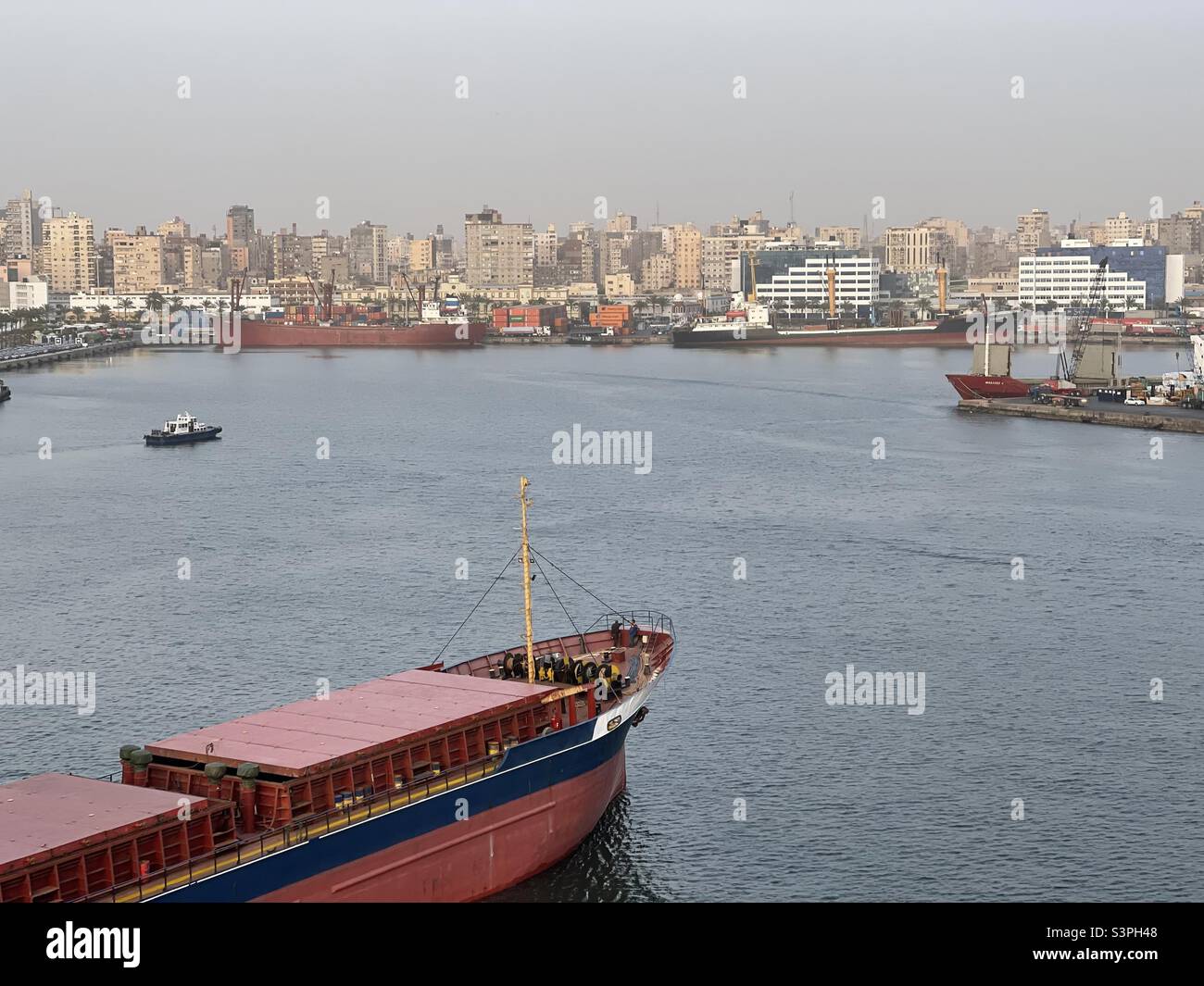 Bow of small bulk carrier which approaching the berth for mooring and