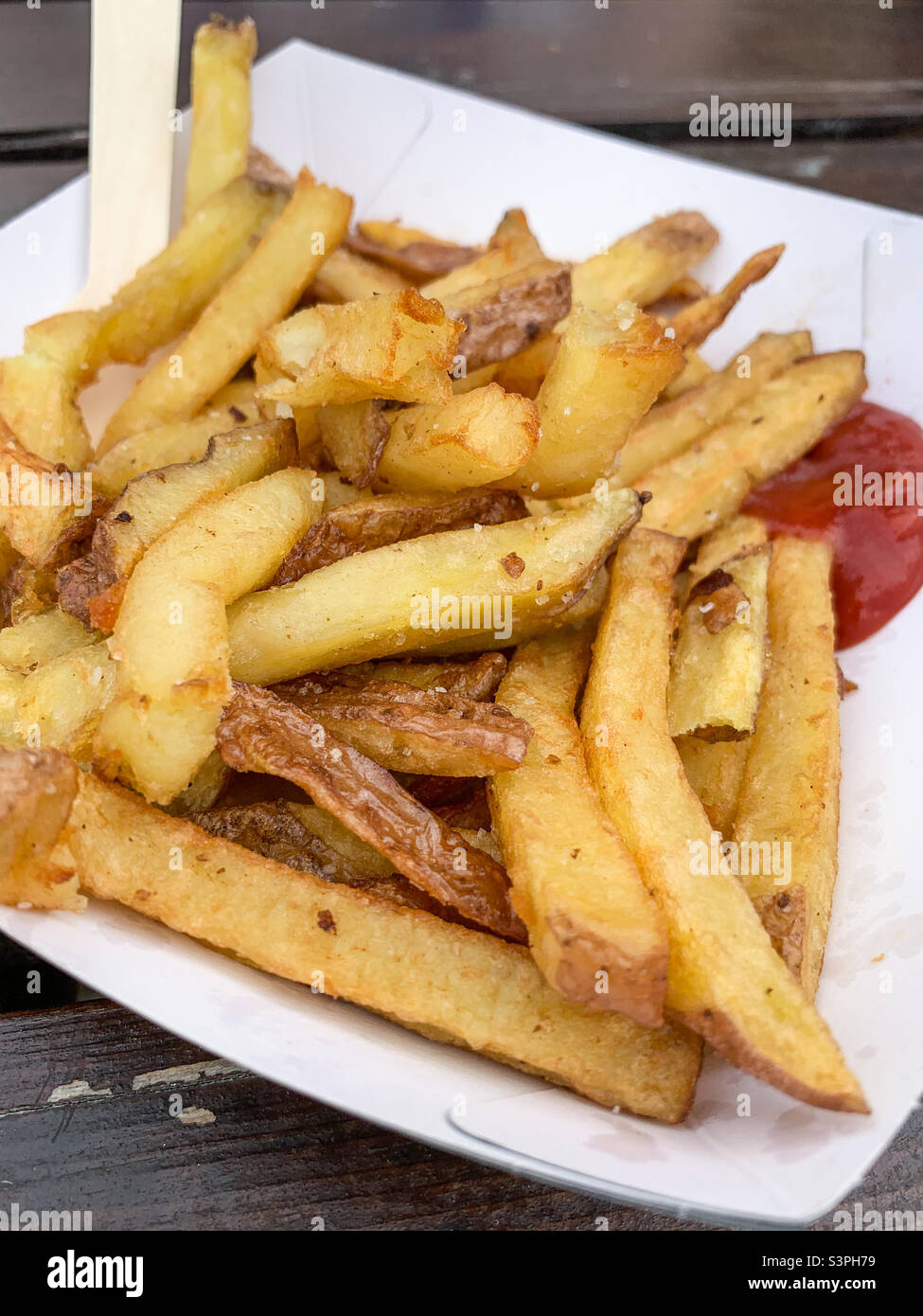 Bowl of chips with ketchup Stock Photo Alamy