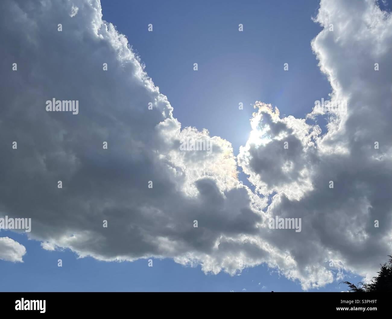 Clouds in a bright blue sky - Smartphone Captured Stock Image