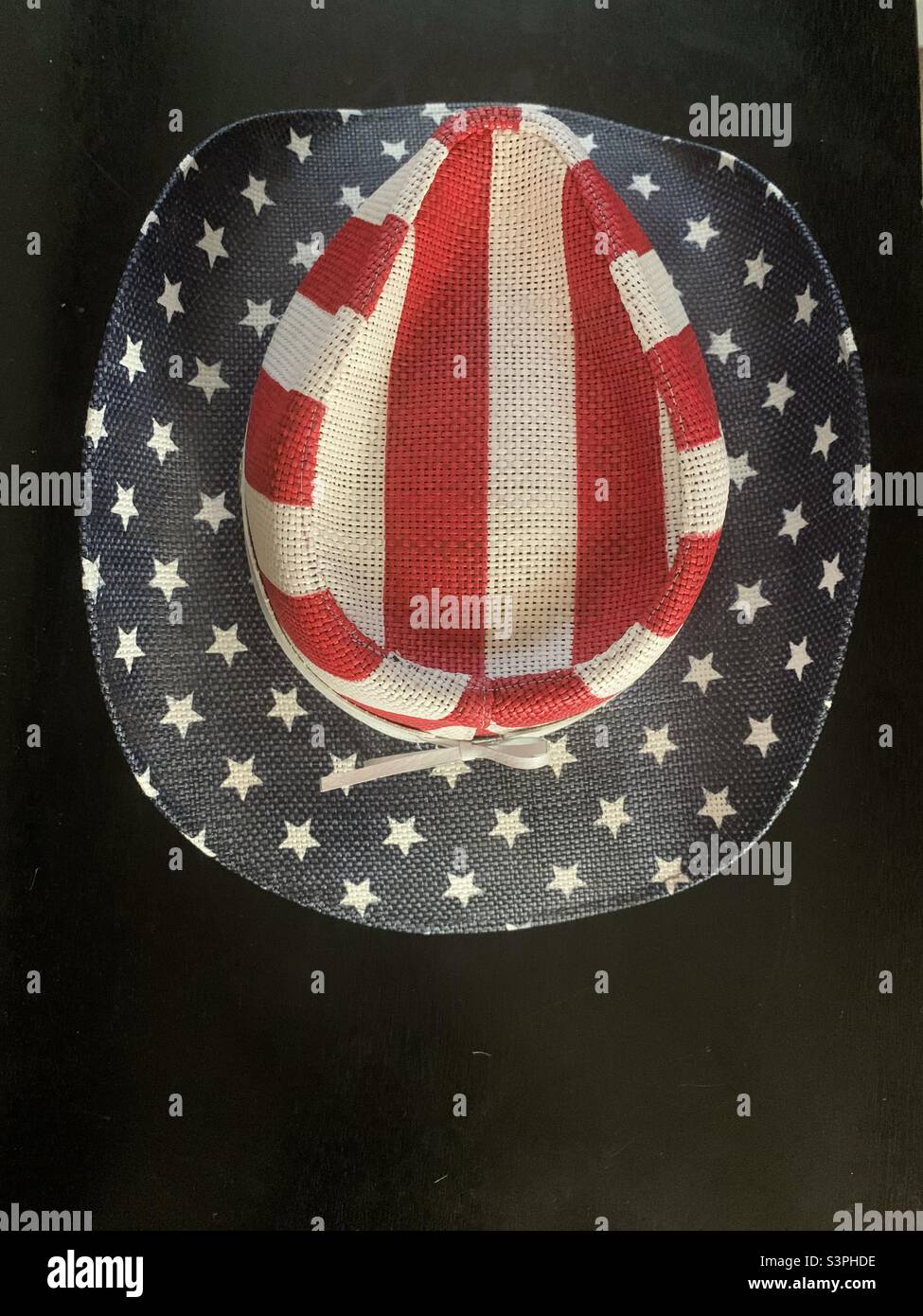 Western cowboy hat with the American flag colors of the red white and blue- Stars and Stripes Stock Photo