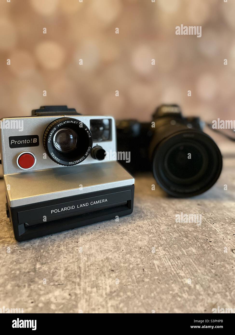 Retro Polaroid meets DSLR camera - Smartphone Captured Stock Image Retro Polaroid meets DSLR camera - Smartphone Captured Stock Image