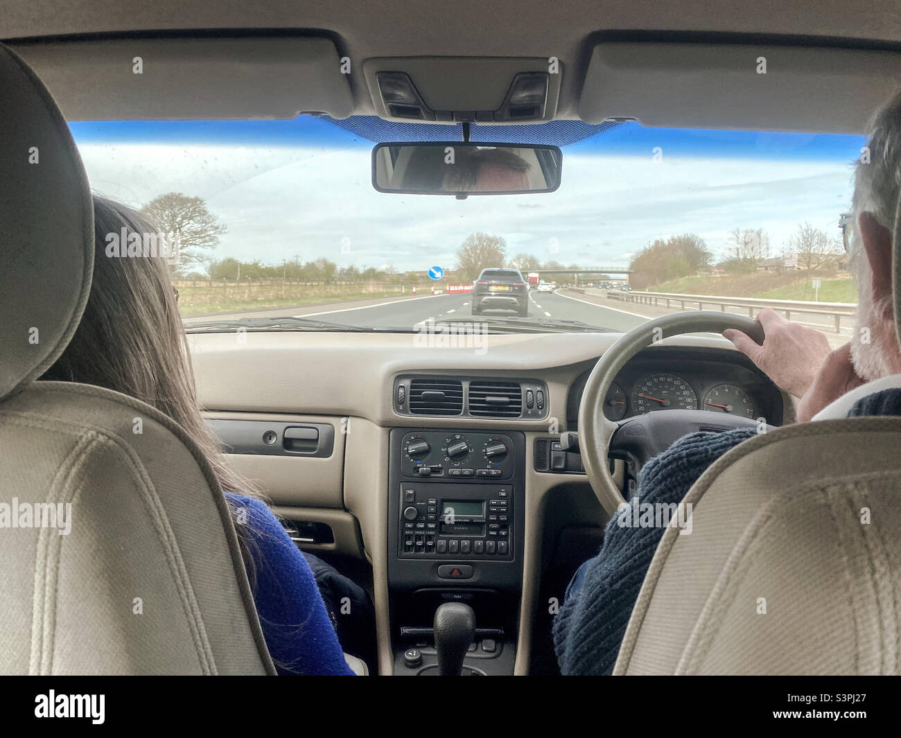 Rear passenger perspective of driving along motorway. - Smartphone Captured Stock Image