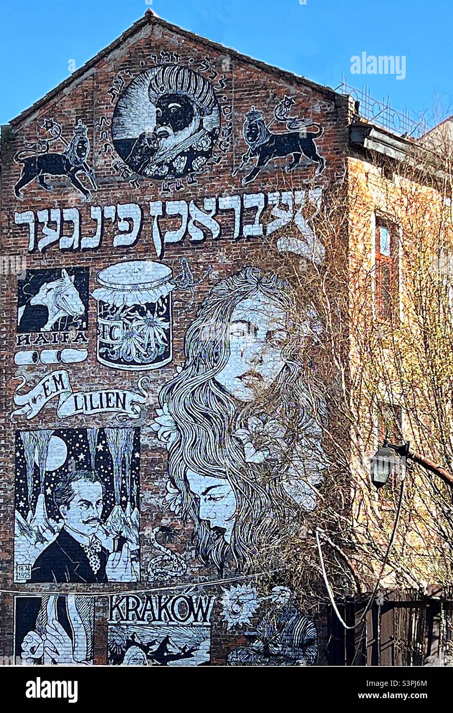 Mural art covering the entire side of a building in the Jewish quarter of Krackow, Poland Stock Photo