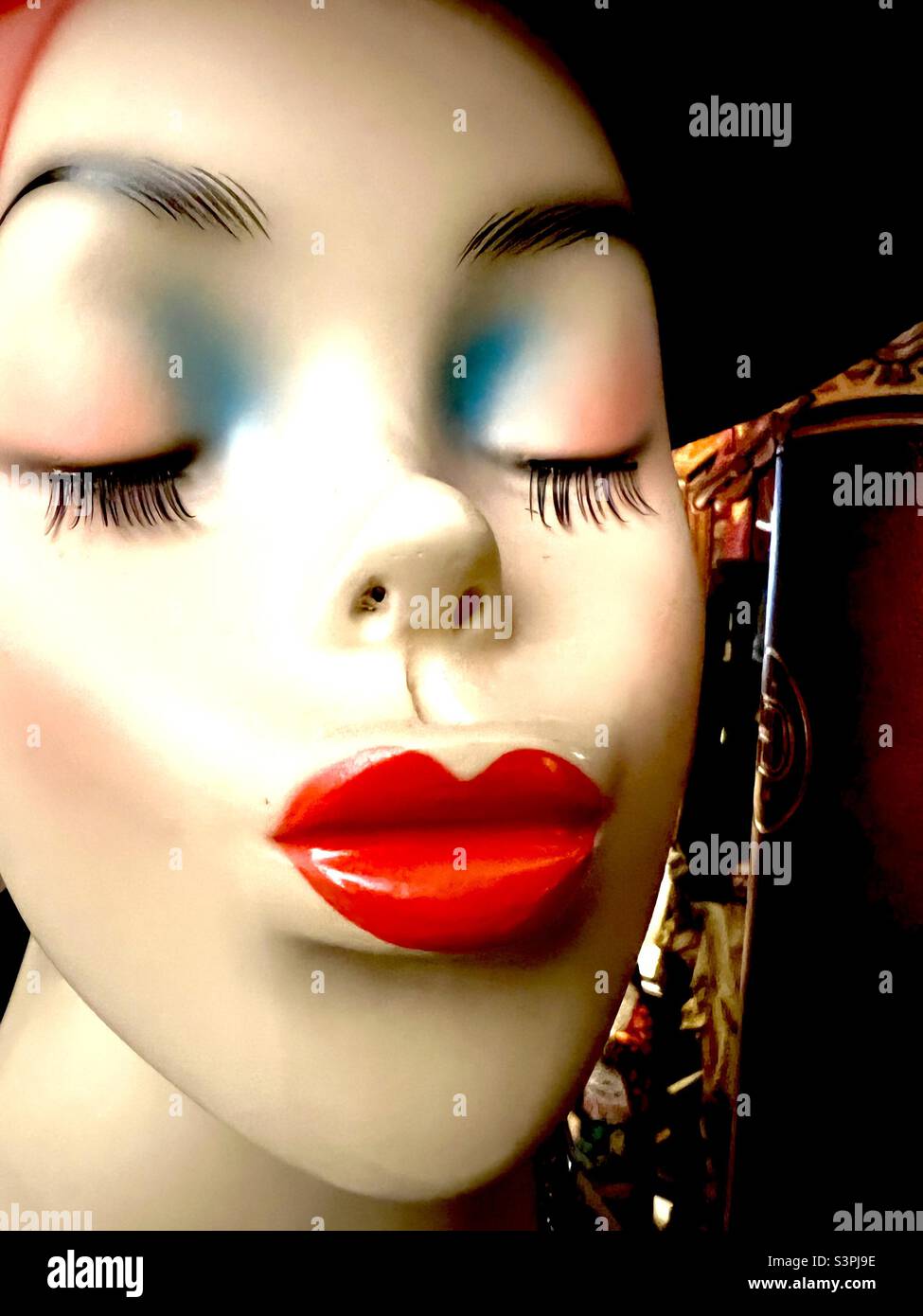 Mannequin head in makeup and red lipstick Stock Photo