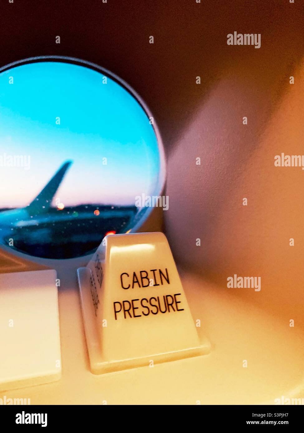 The Cabin Pressure warning indicator at a door window of an Airbus A320