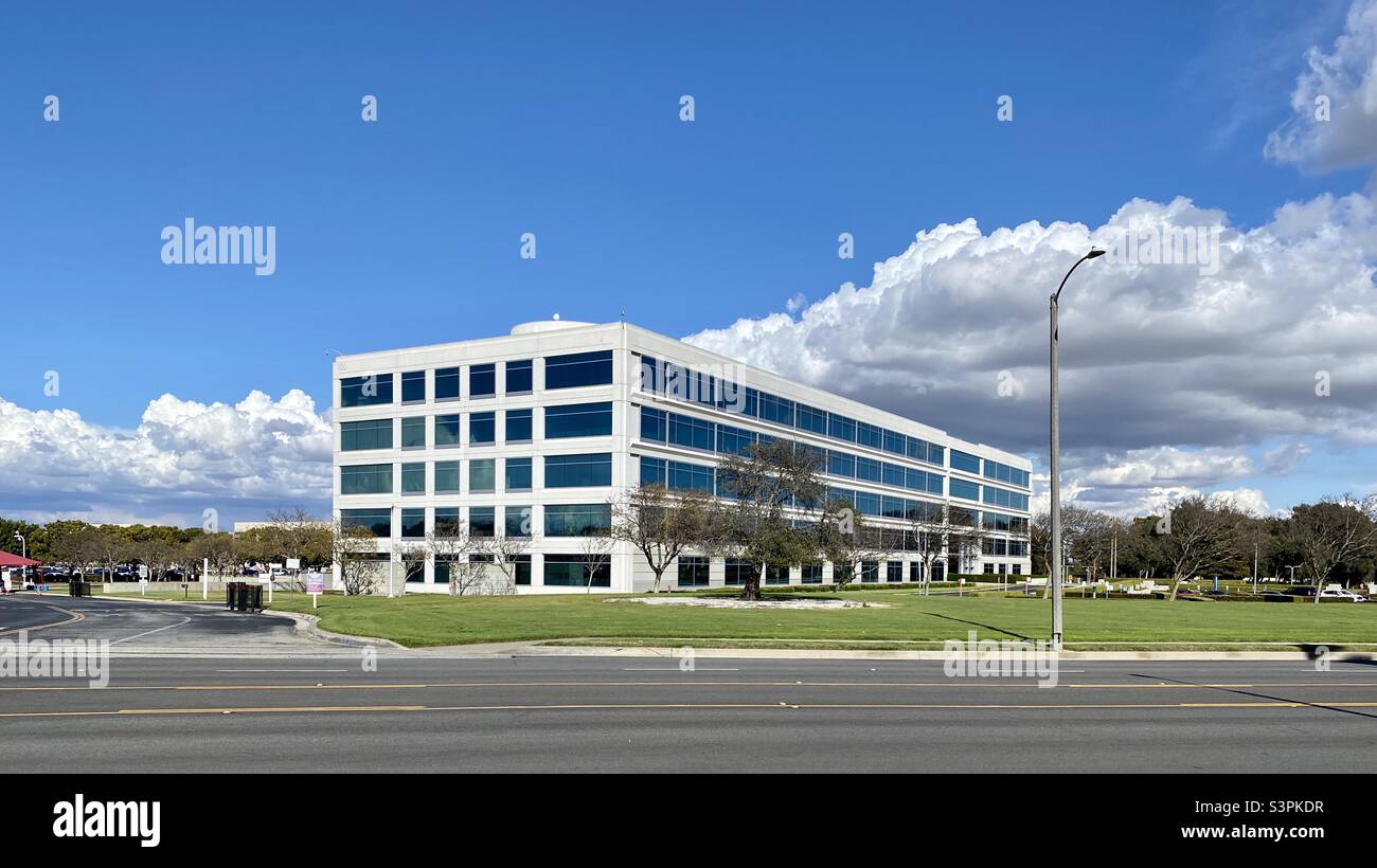 TORRANCE, CA, MAR 2021: American Motor Company offices with white puffy clouds in blue sky overhead - Smartphone Captured Stock Image