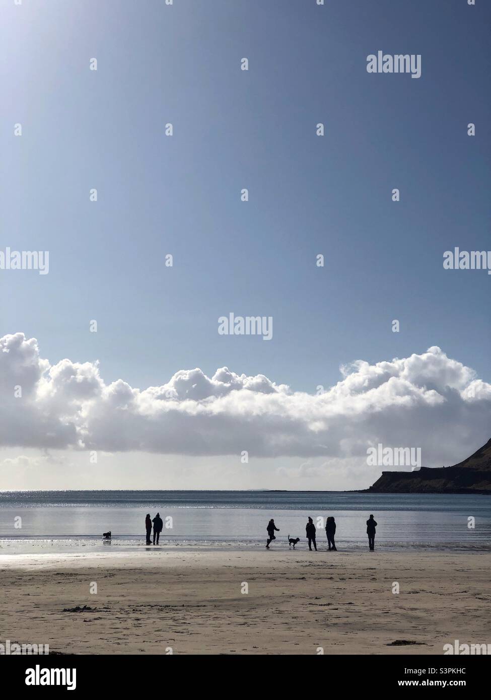 People on Calgary bay at low tide, Isle of Mull, Scotland Stock Photo