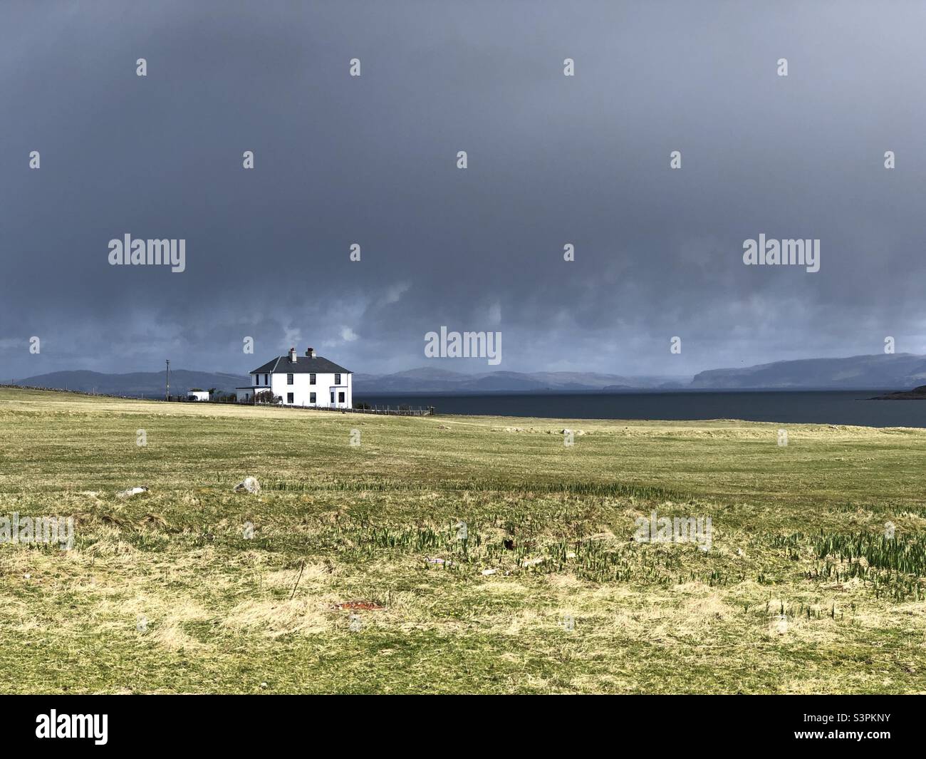 White House under a brooding sky, Isle of Iona, Scotland - Smartphone Captured Stock Image