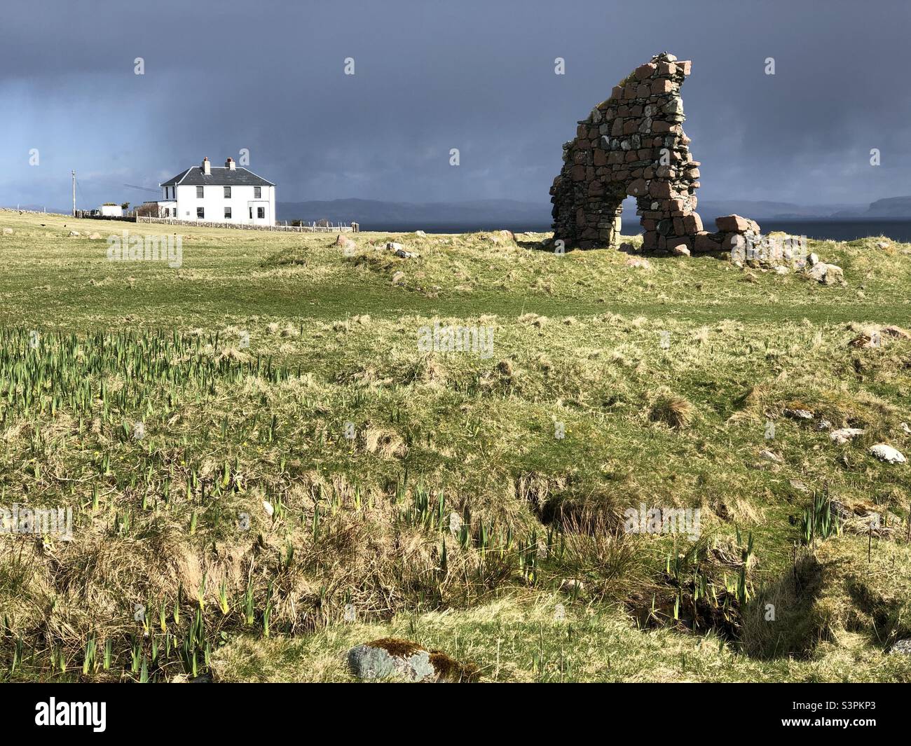 White House and ruin under a brooding sky, Isle of Iona, Scotland - Smartphone Captured Stock Image