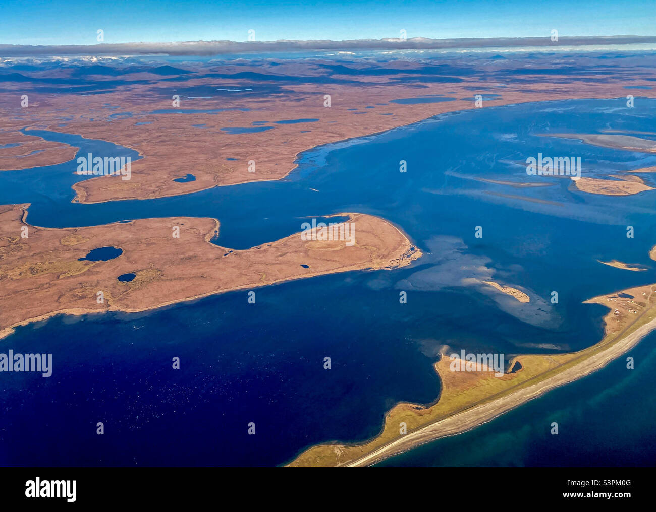 The tundra and brackish waters of the coastline south of Nome, Alaska Stock Photo