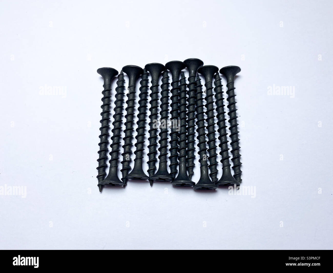 Premium Photo  Metal stainless steel self tapping screws on black wooden  background