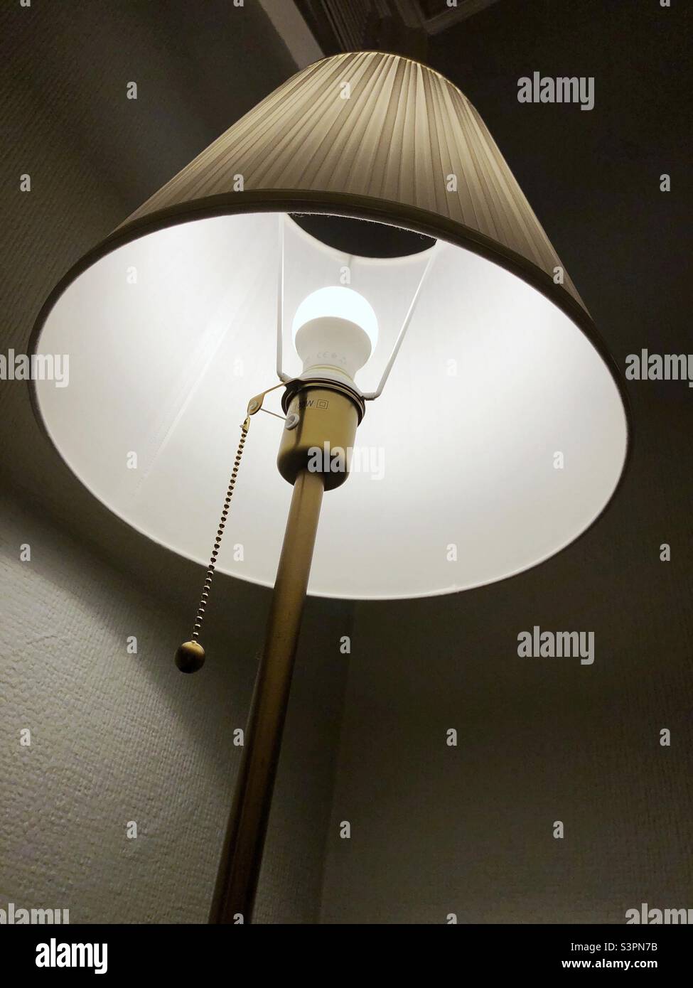 Standard floor lamp lit up in the evening - Smartphone Captured Stock Image