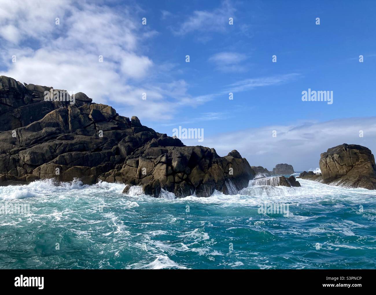 Wild and stormy sea crashing against rocks, Isles of Scilly, the southern tip of the United Kingdom and British isles. - Smartphone Captured Stock Image
