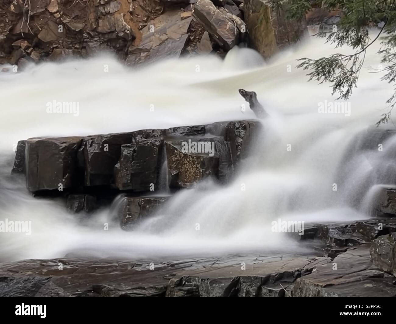 Long exposure image of Austin Falls on the Sacandaga River in high water Stock Photo