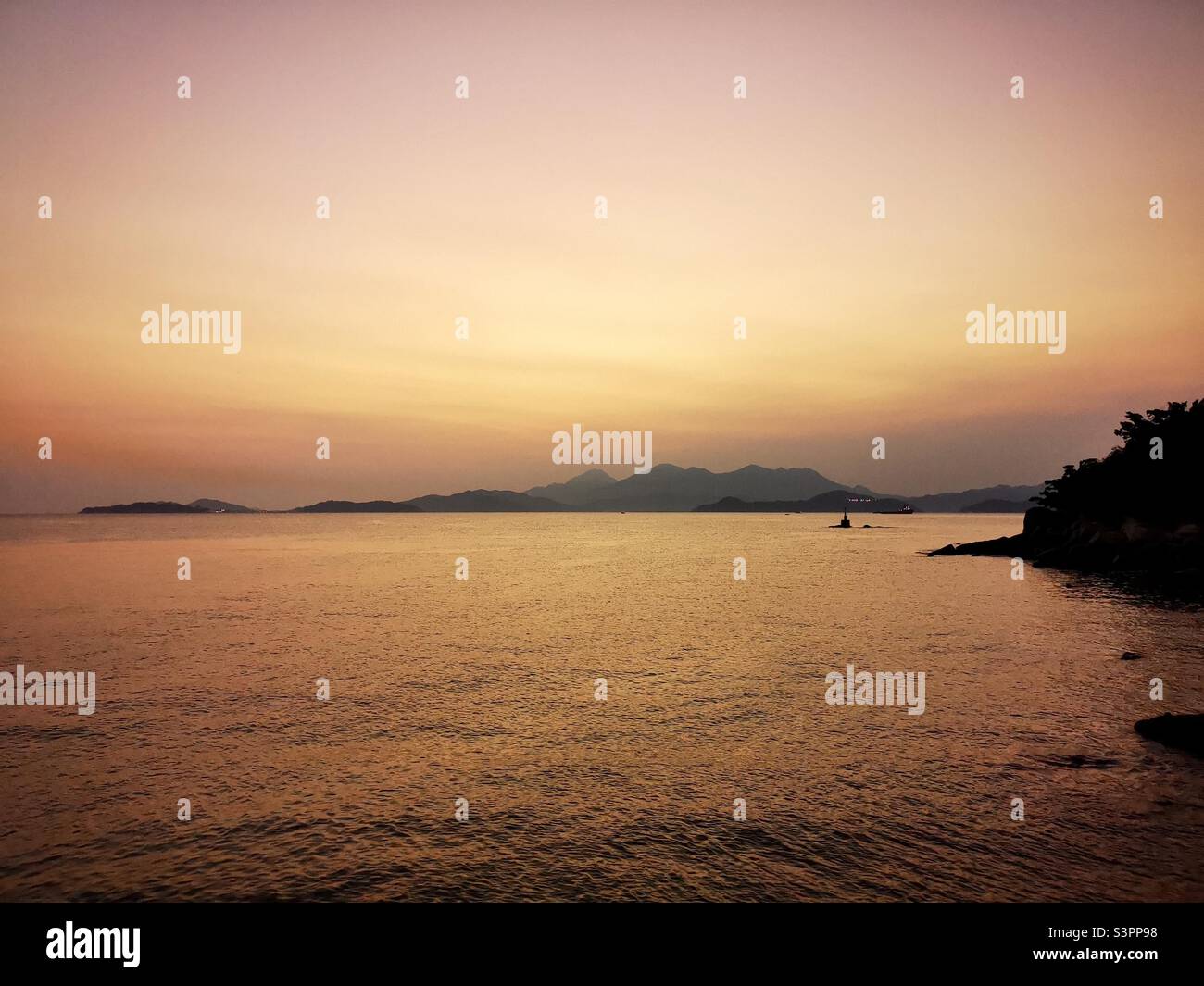 A beautiful sunset seen from Lamma island in Hong Kong. Stock Photo