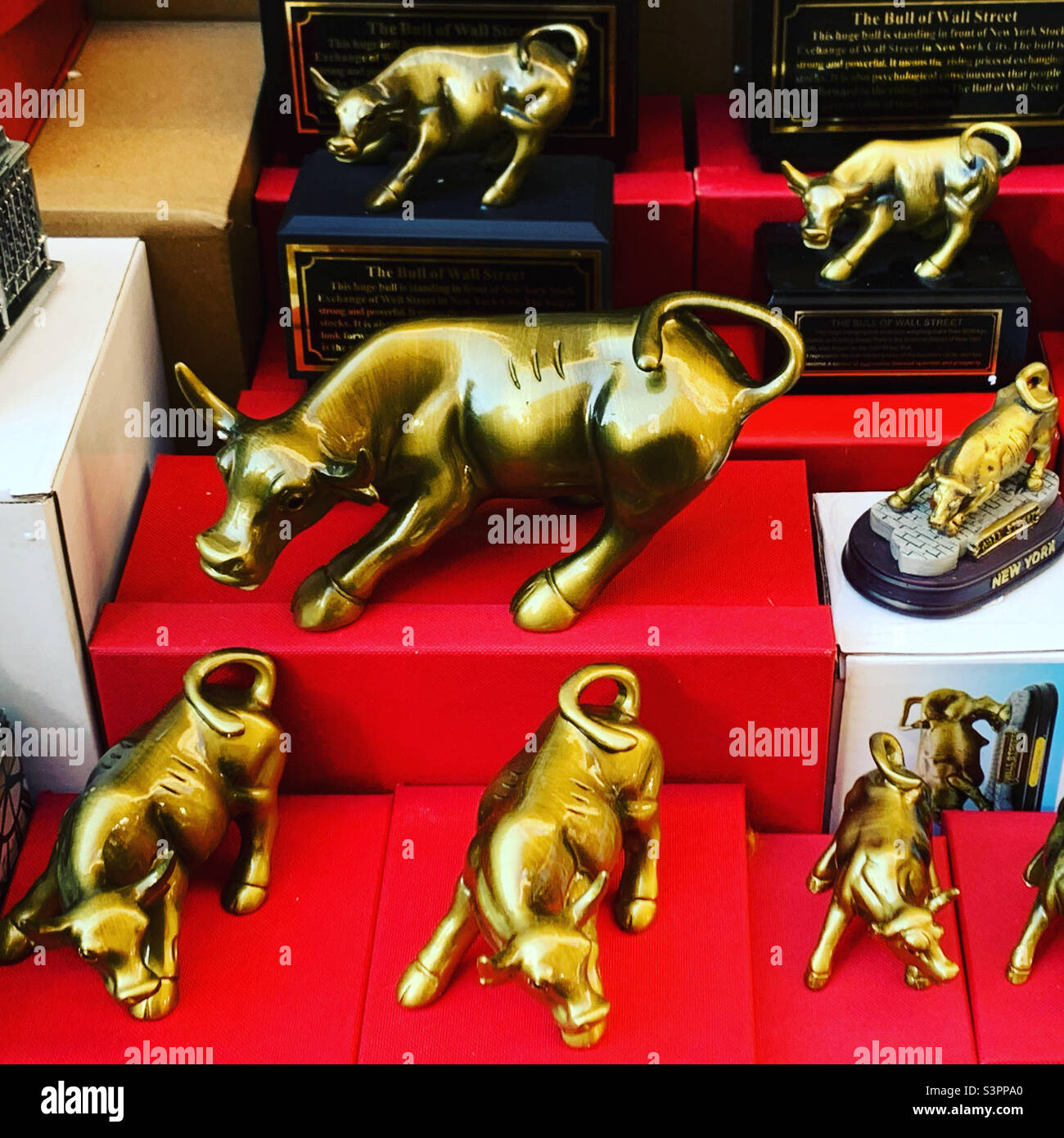 December, 2021, souvenirs of the Charging Bull sculpture for sale, Financial District, Lower Manhattan, New York, New York, United States - Smartphone Captured Stock Image