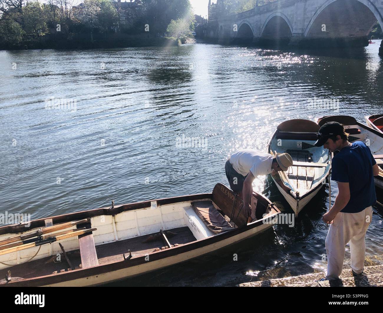Men on a boat on river Thames in Richmond London - Smartphone Captured Stock Image