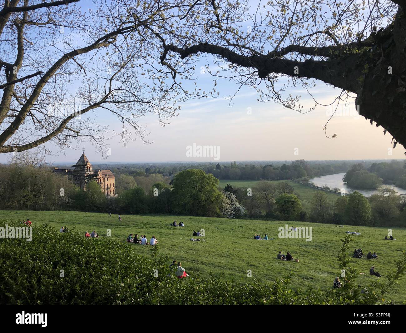 People are sitting on grass in Richmond hill on a nice sunny day - Smartphone Captured Stock Image