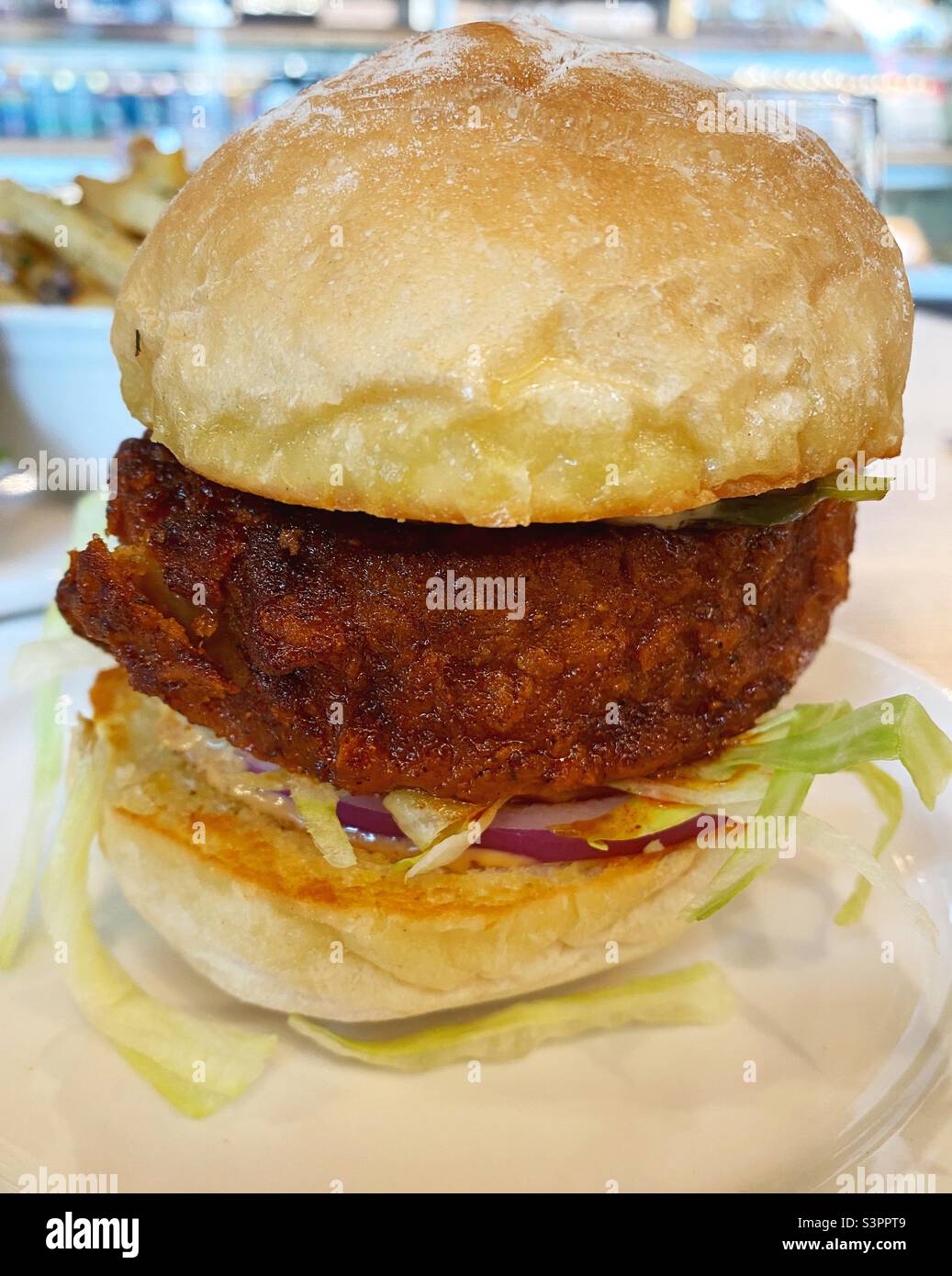 A Nashville style vegan chicken sandwich, from The Very Good Butchers in Victoria, British Columbia, Canada. Stock Photo