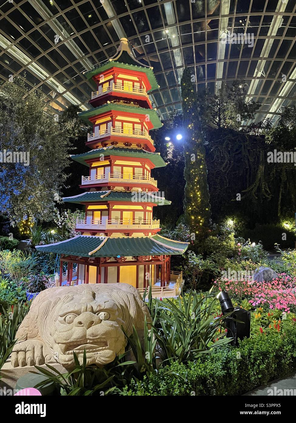 Chinese pagoda in Singapore’s flower dome Stock Photo
