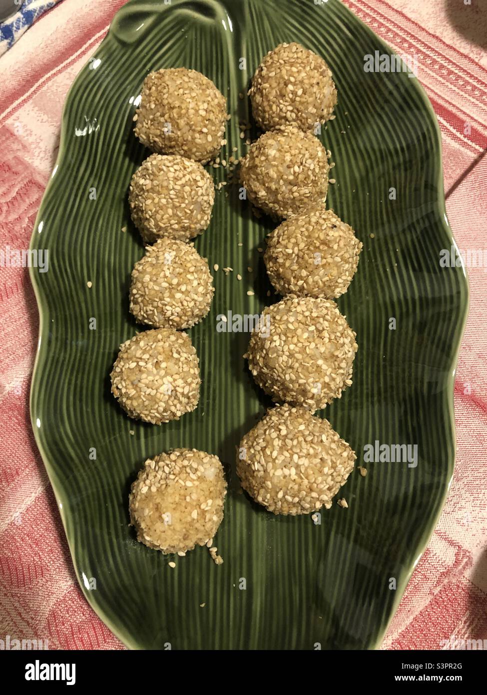 Rice balls served on a green plate - Smartphone Captured Stock Image