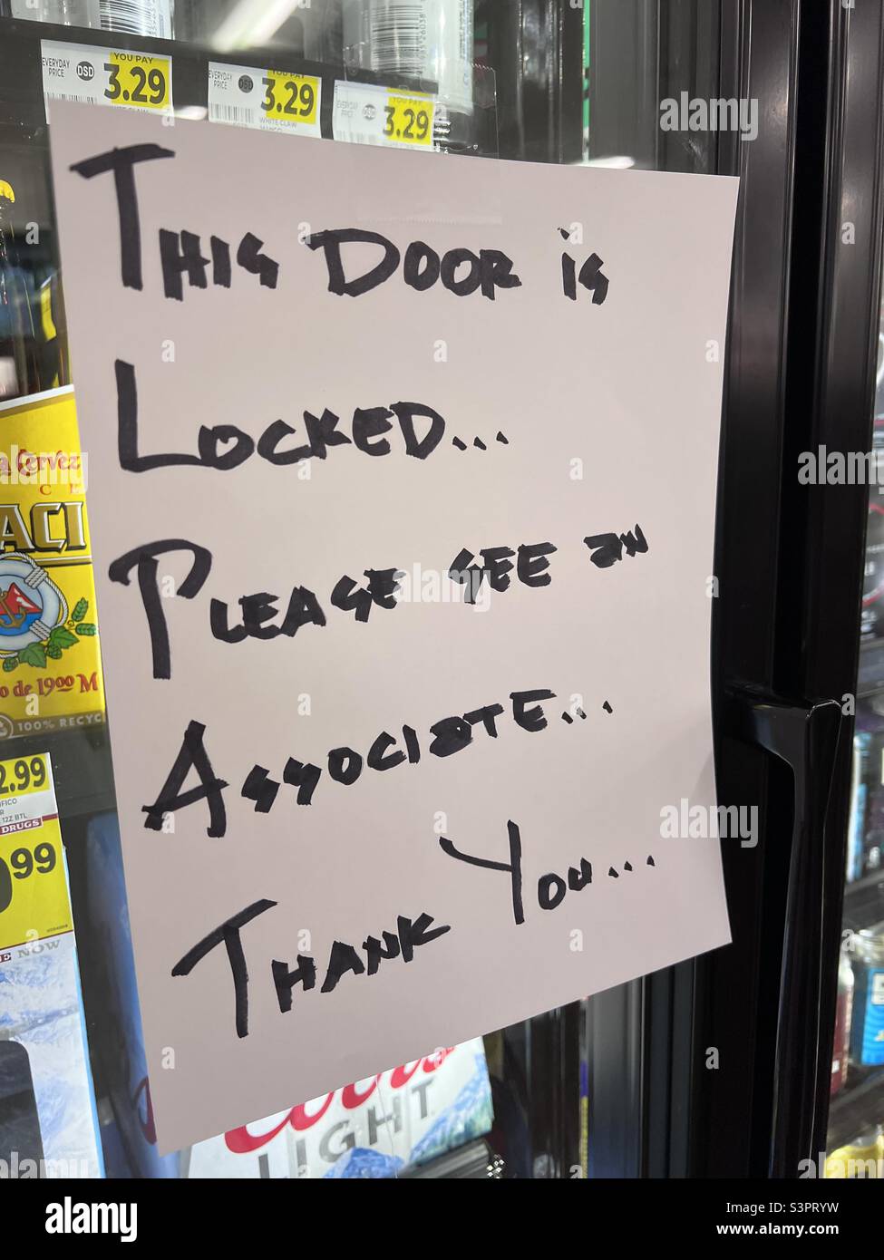 Seattle, USA. 18th April, 2022. Locked up alcohol at a Bartels store in Belltown. Seattle is experiencing a surge in crime in the downtown core prompting stores to begin locking up display cases. - Smartphone Captured Stock Image