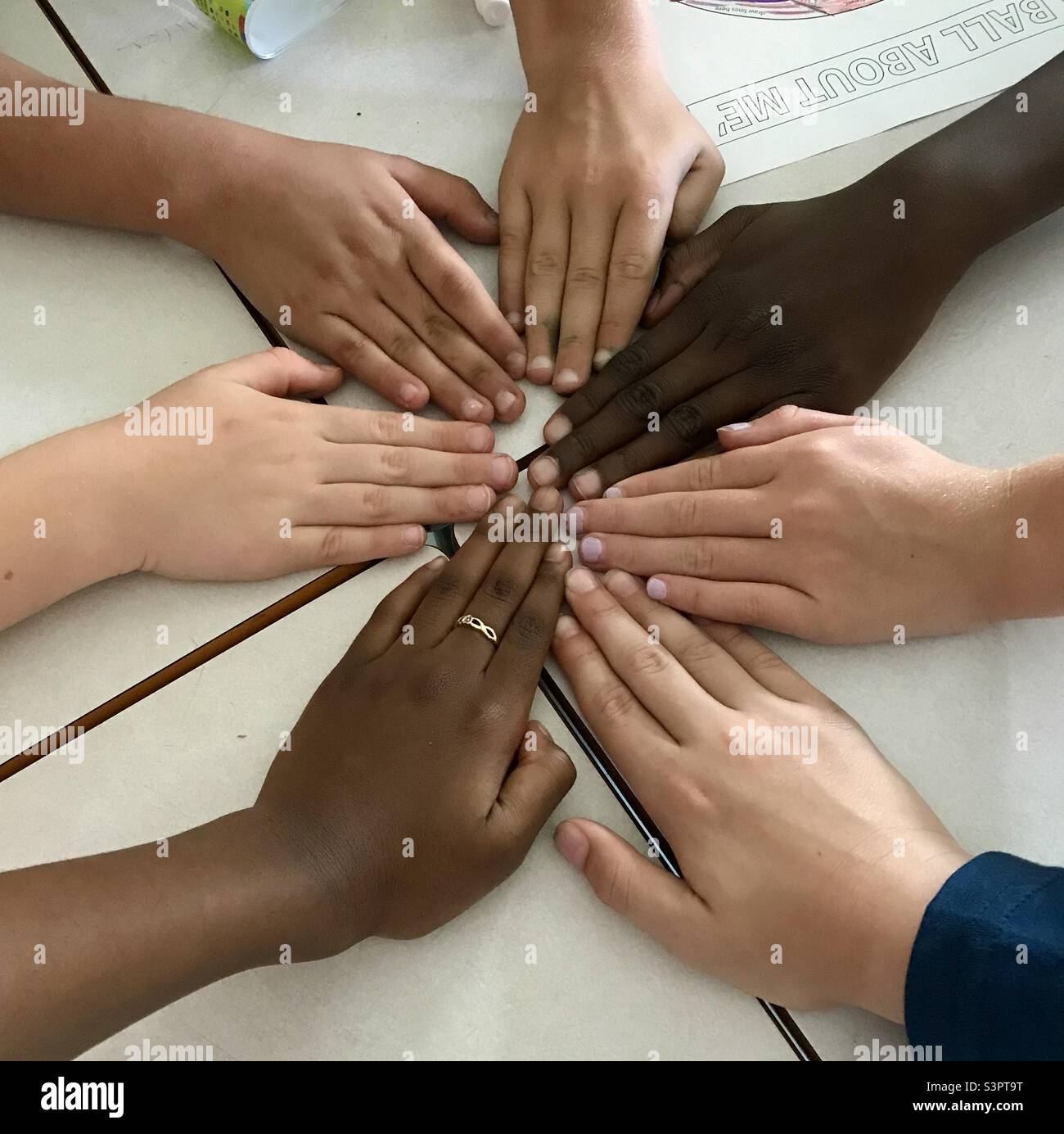 Children’s hand in a start shape. Diversity makes us stronger. - Smartphone Captured Stock Image