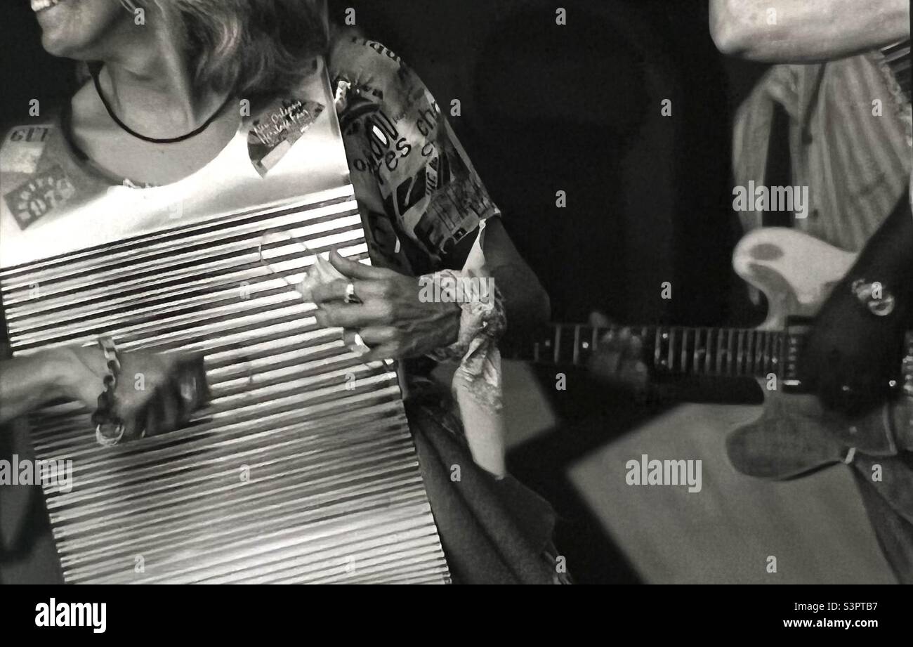 Musicians playing washboard at New Orleans Jazz and heritage festival