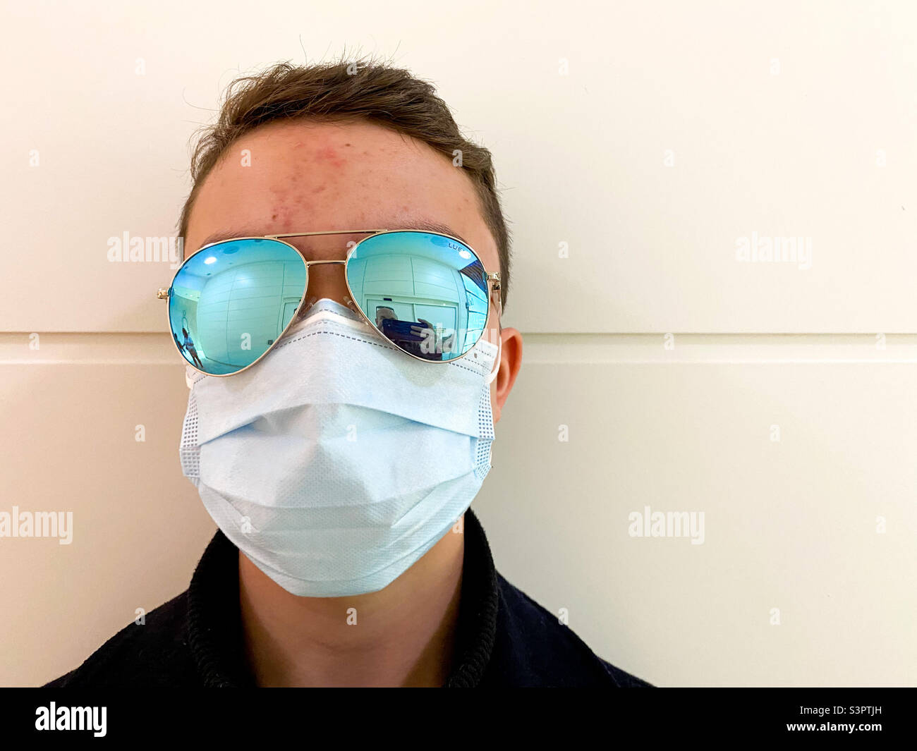 Portrait of a boy wear big sunglasses and a face mask. - Smartphone Captured Stock Image