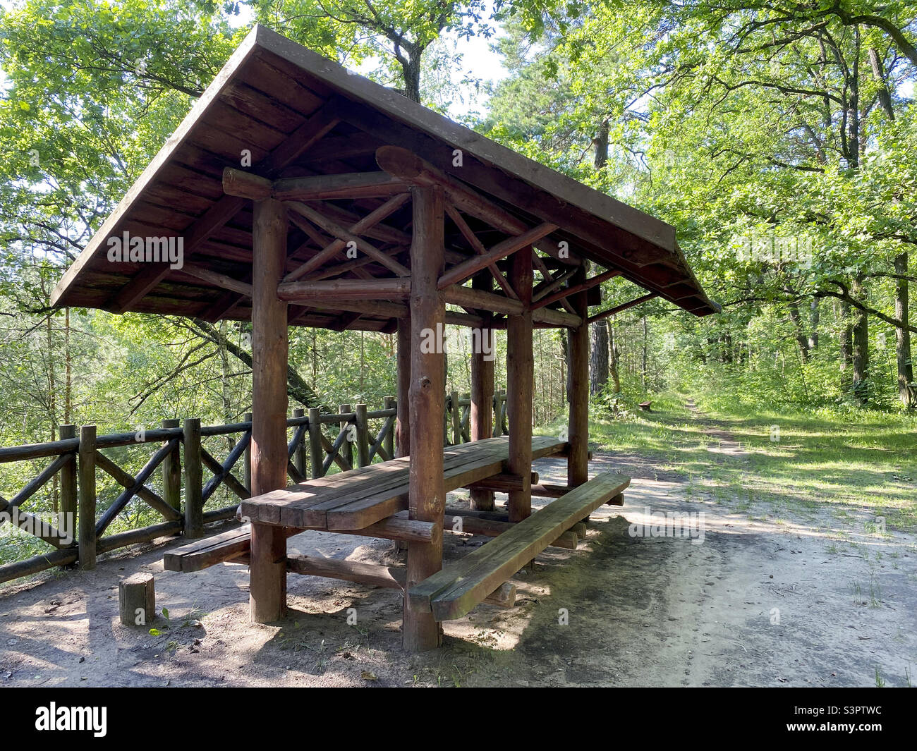 Wooden gazebo for vacationers in the forest Stock Photo