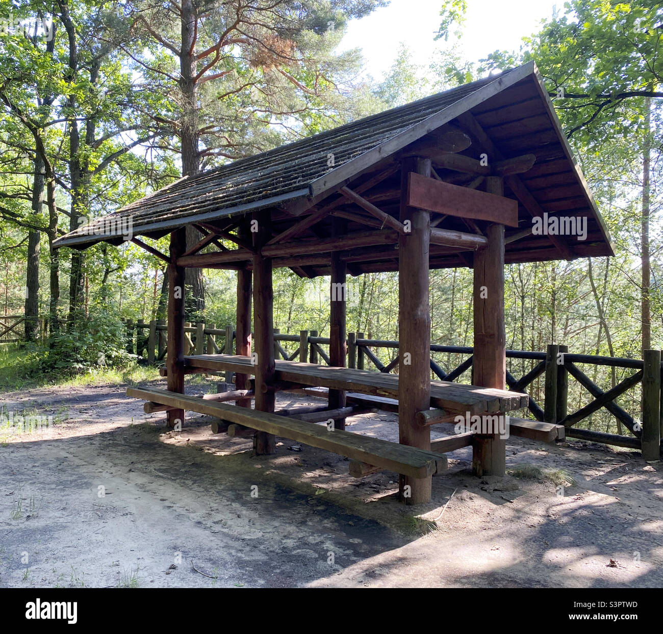 Wooden gazebo for vacationers in the forest - Smartphone Captured Stock Image