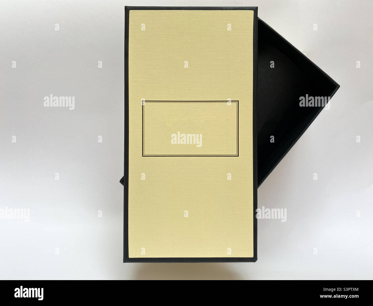 A bottle of perfume from a yellow box on a white isolated background ...