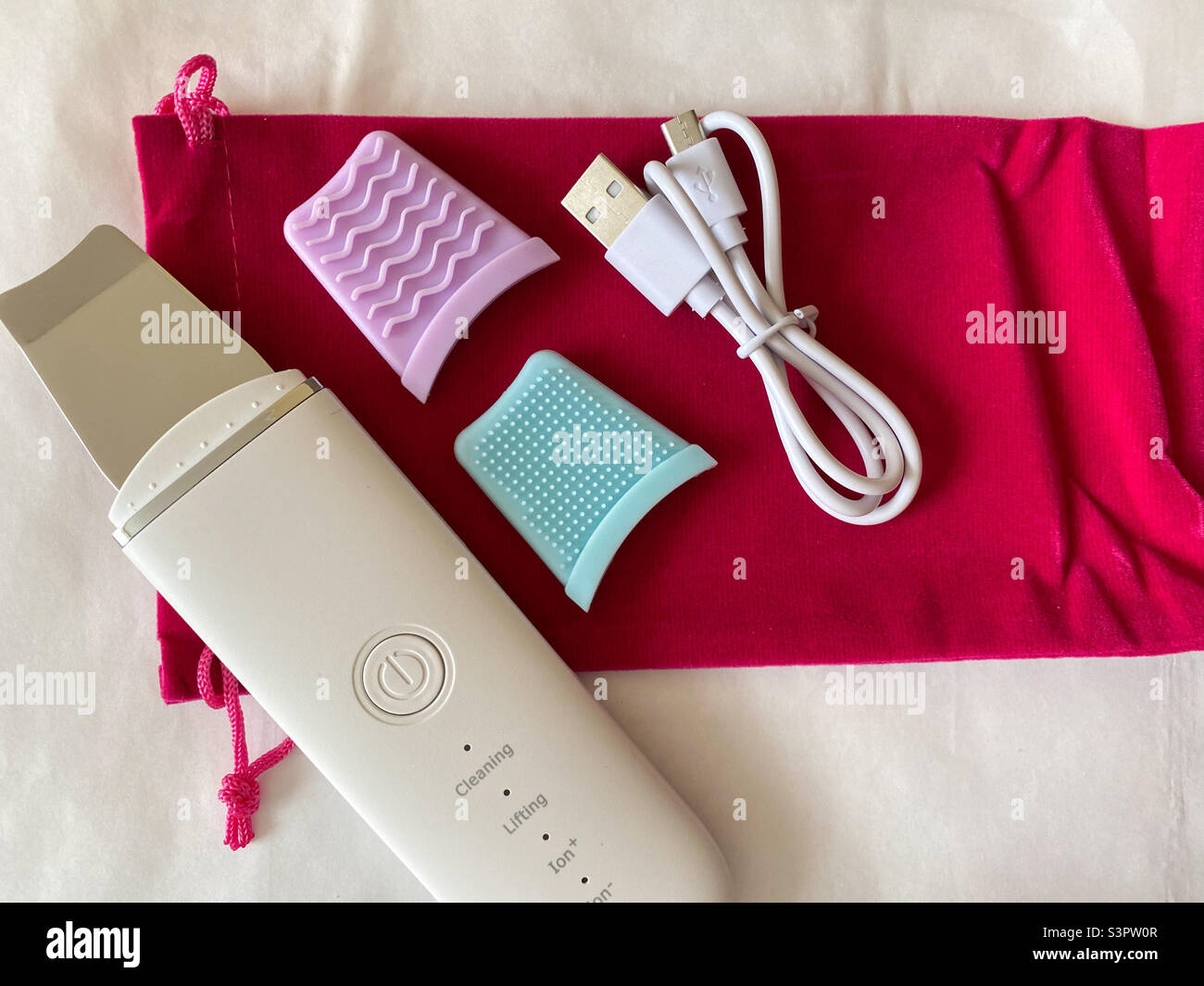 Ultrasonic peeling is a surface physical peeling that provides rejection of the keratinized layer of the skin due to the action of ultrasonic waves - Smartphone Captured Stock Image