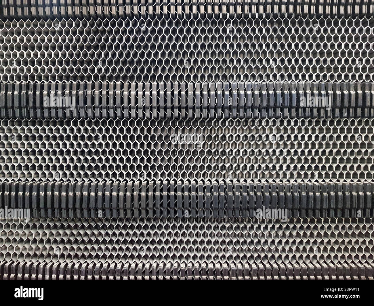 Background of the plate heat exchanger radiator grille Plate heat exchanger for heat transfer from a hot heat carrier to a cold medium - Smartphone Captured Stock Image